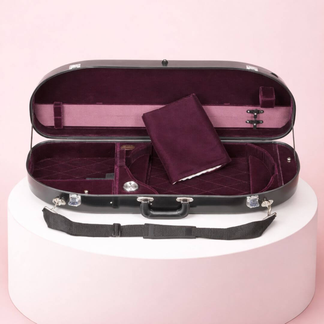 An open black violin case with a plush, quilted deep purple interior, sitting on a white pedestal.