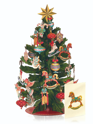 Decorative paper Christmas tree with ornaments and a card featuring a rocking horse.