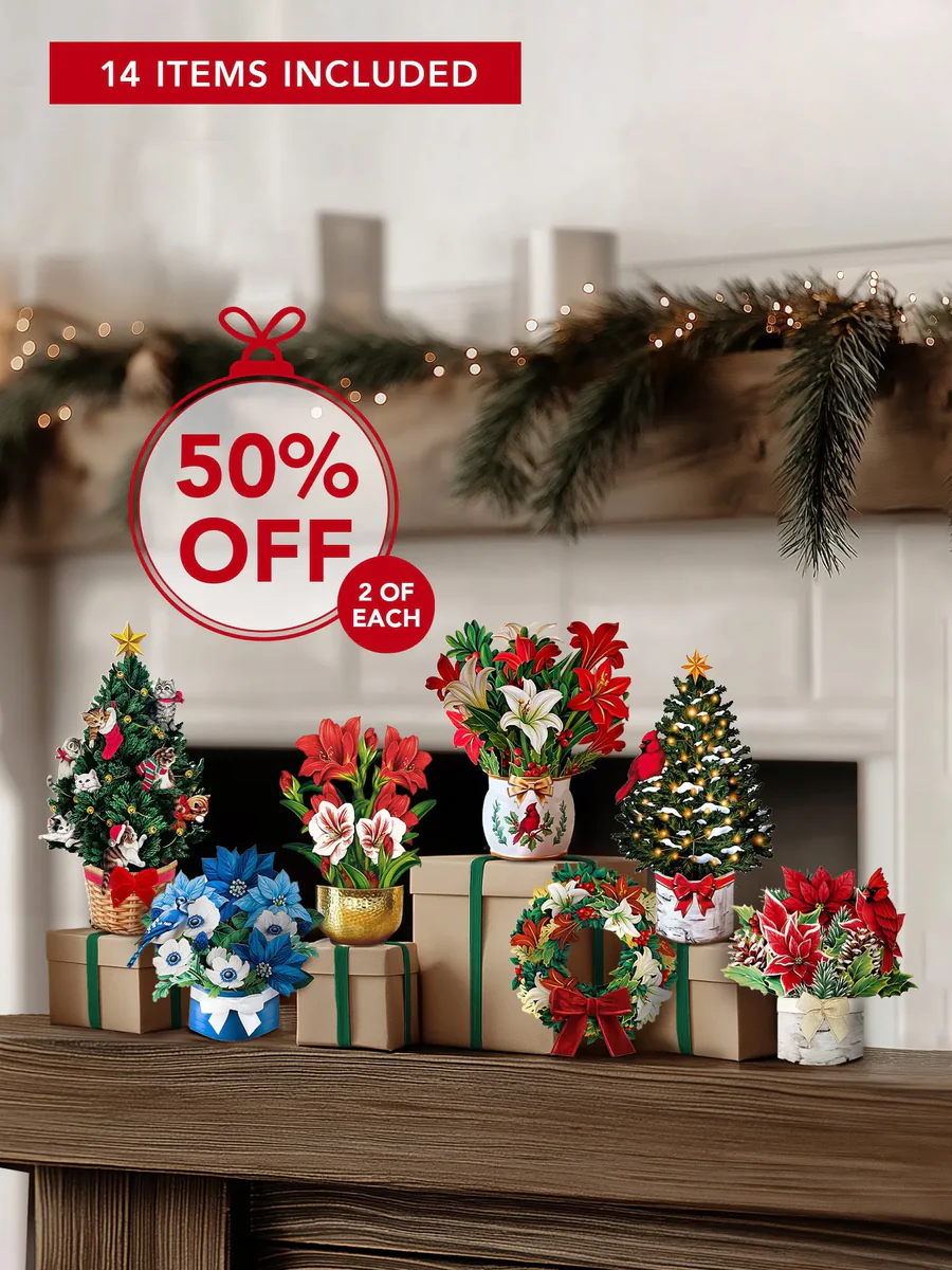 Christmas decorations and gifts on a mantel with a 50% off sign.