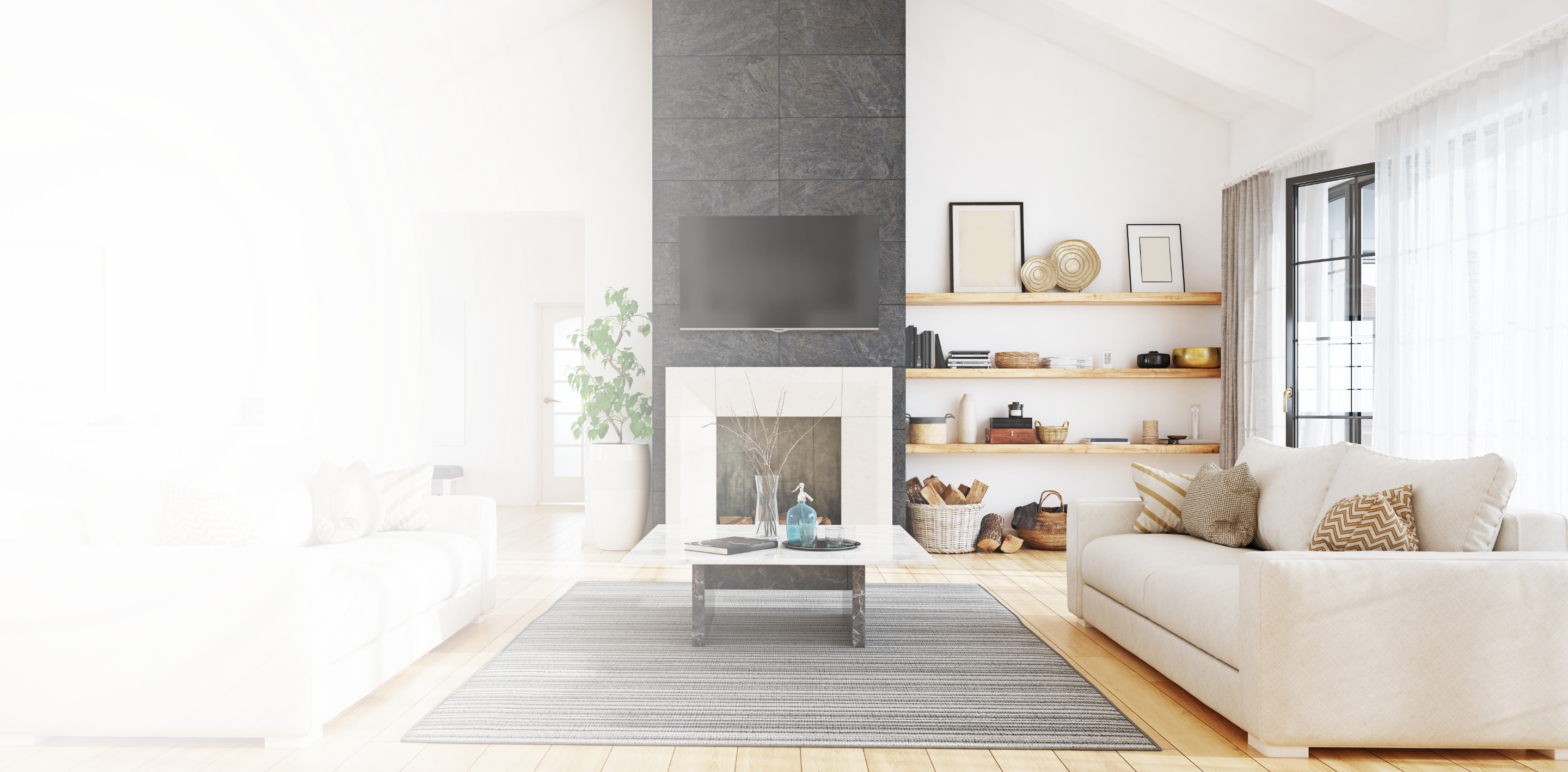 A bright, modern living room with a stone fireplace and floating shelves, with a white fade on the left.