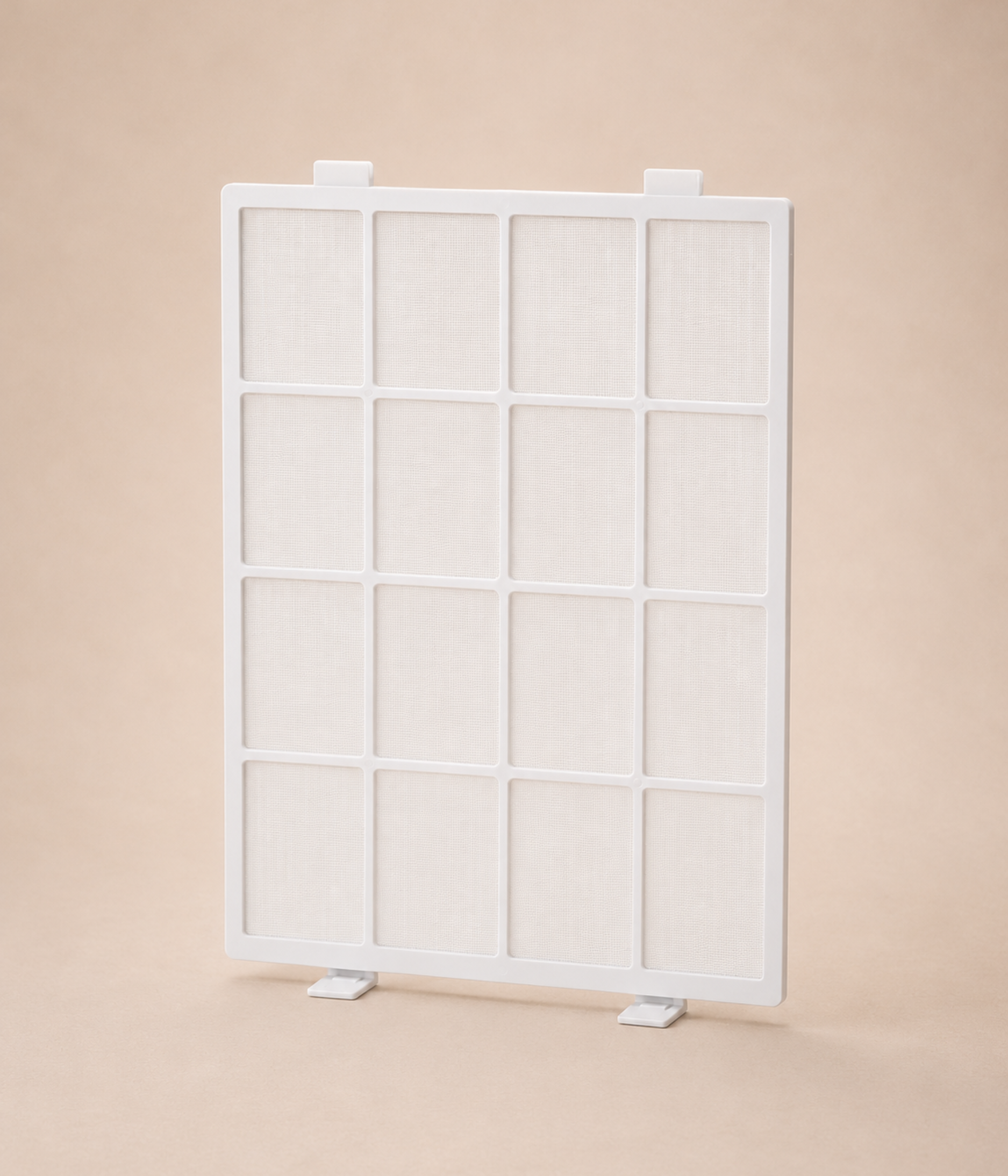 A white rectangular air filter with a grid frame stands vertically against a light brown background.