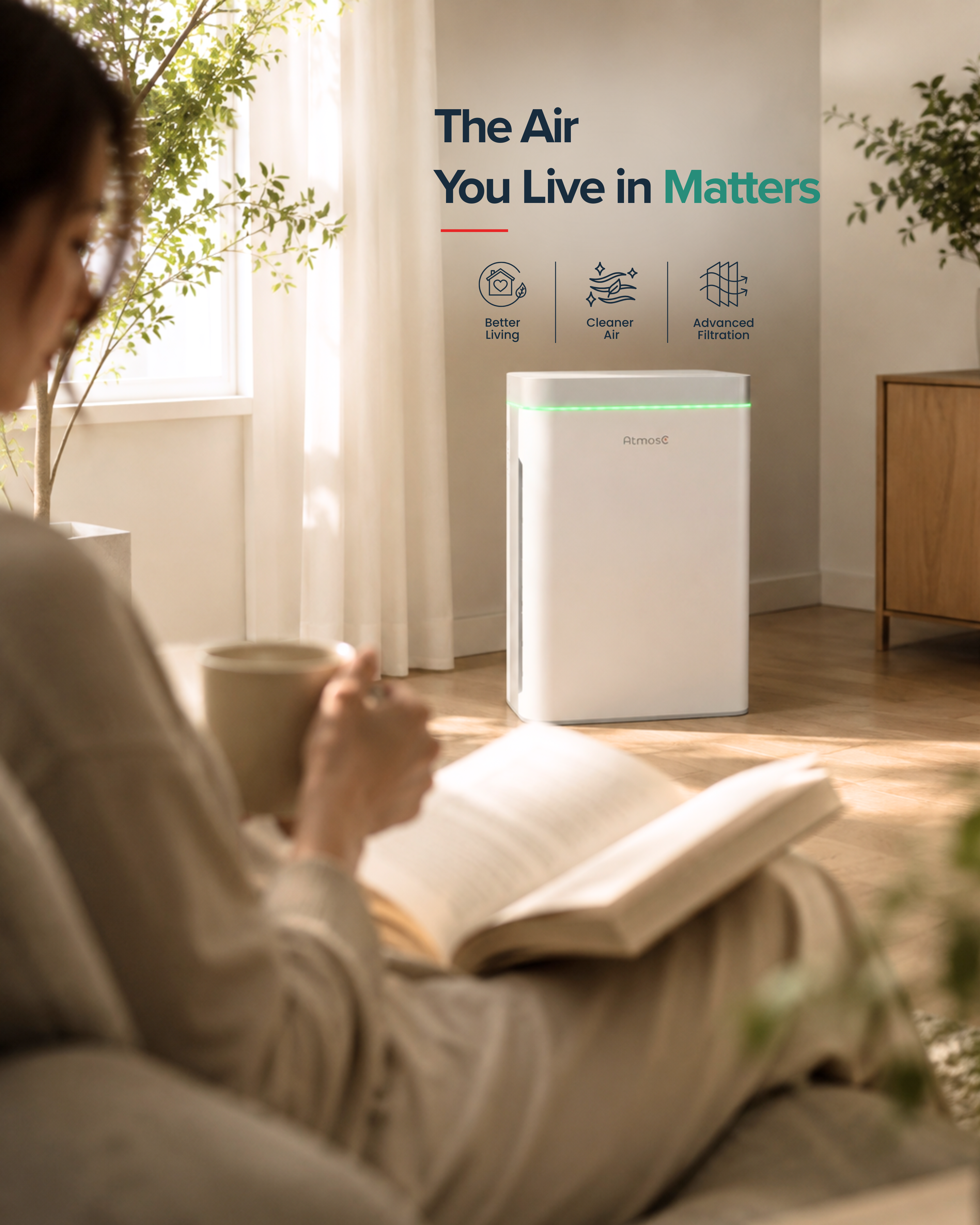 A white air purifier on wheels in a sunlit living room with a woman reading on a sofa.