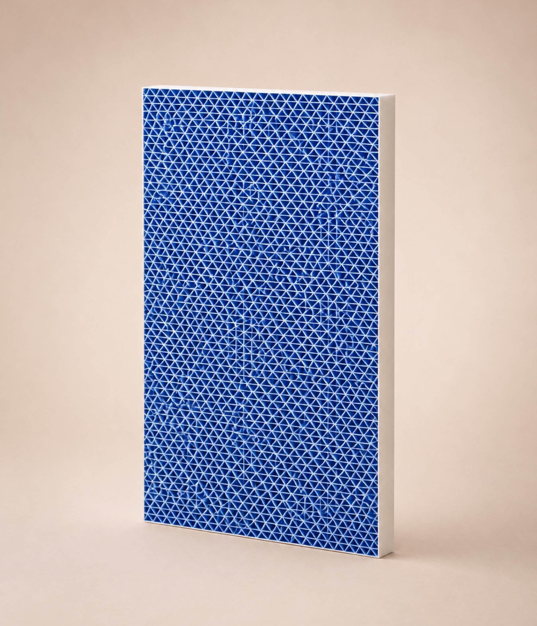 A rectangular air filter with a blue triangular grid and white frame against a light brown background.