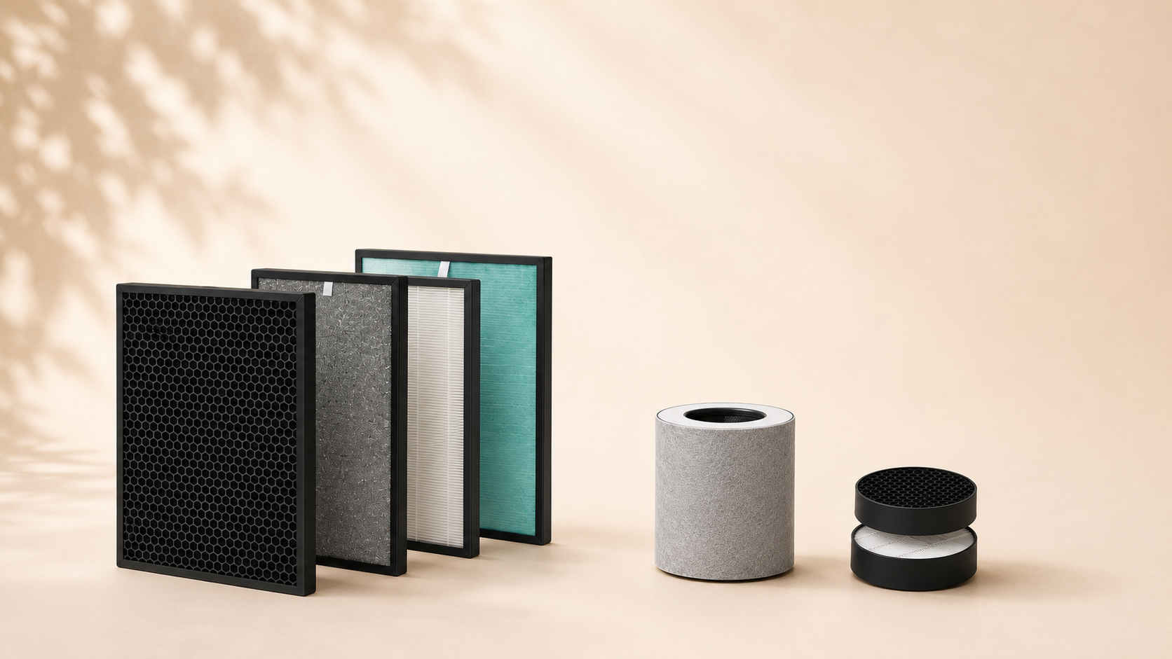 A collection of various rectangular and cylindrical air purifier filters arranged on a peach-colored background.