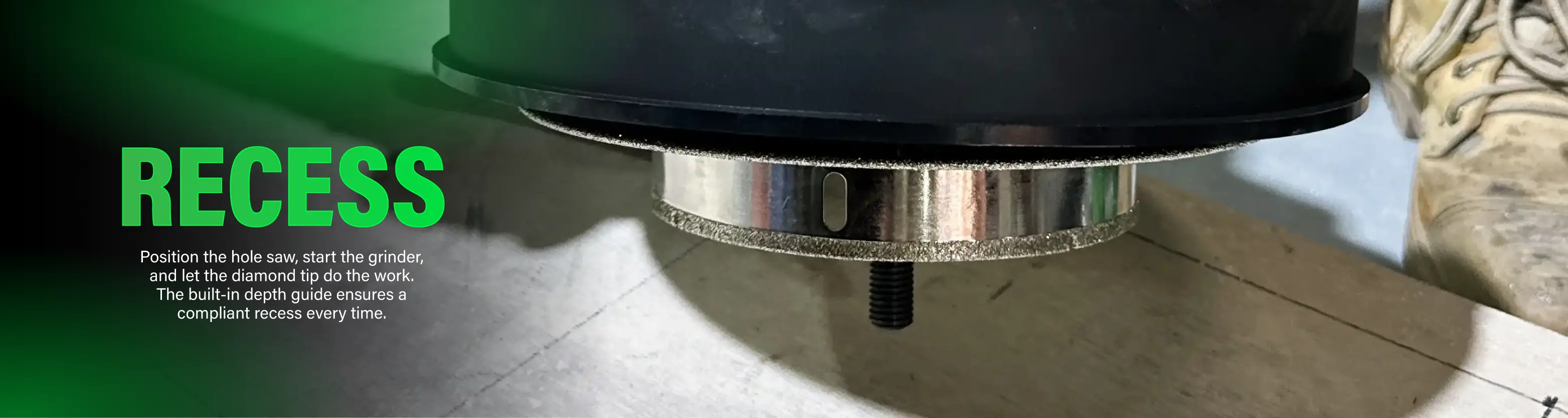 Diamond-tipped hole saw tool positioned over a surface, with 'RECESS' text and part of a boot.