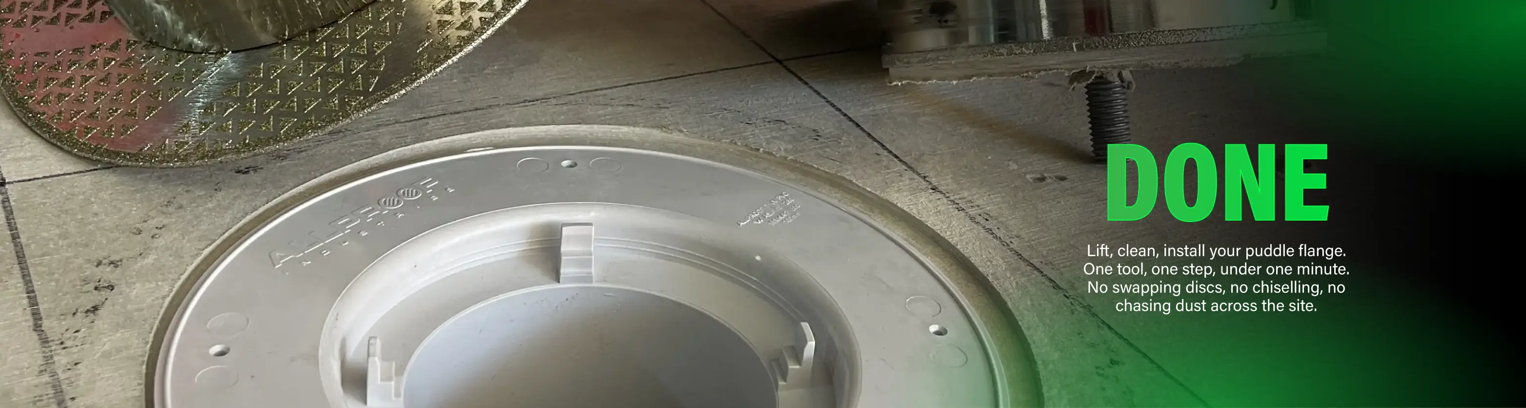 A close-up of a power tool cutting a recess in a floor for a puddle flange.