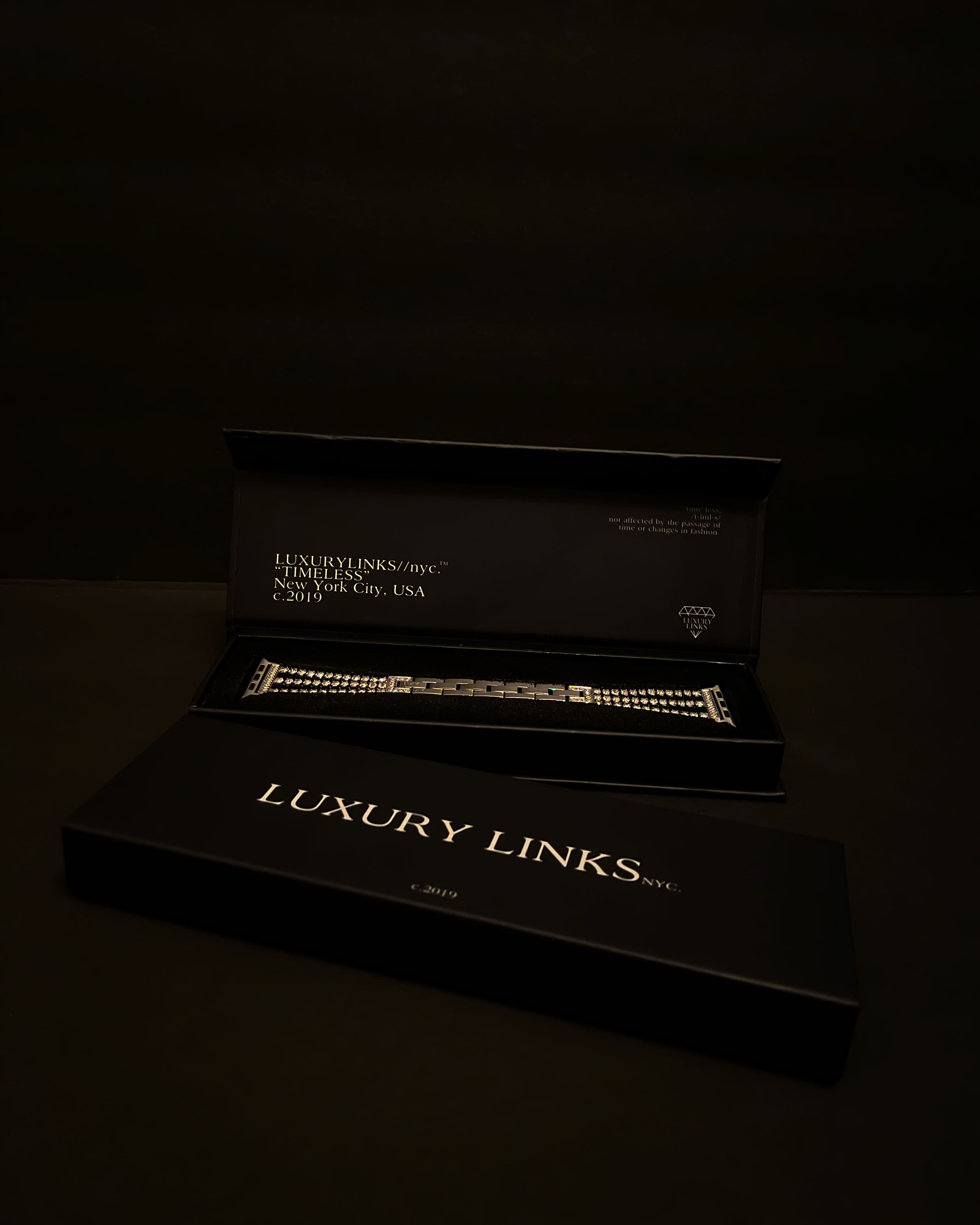 Black box with a luxury bracelet inside, labeled 'Luxury Links NYC.'