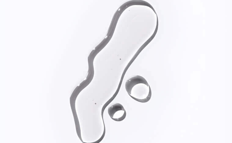 Clear water droplets on a plain surface.