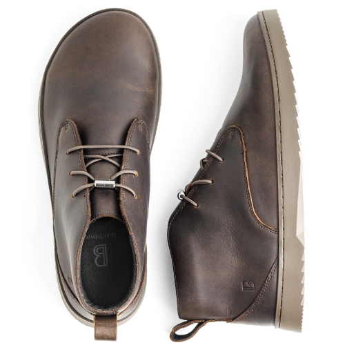 A top-down and side view of a pair of brown leather ankle boots on a white background.