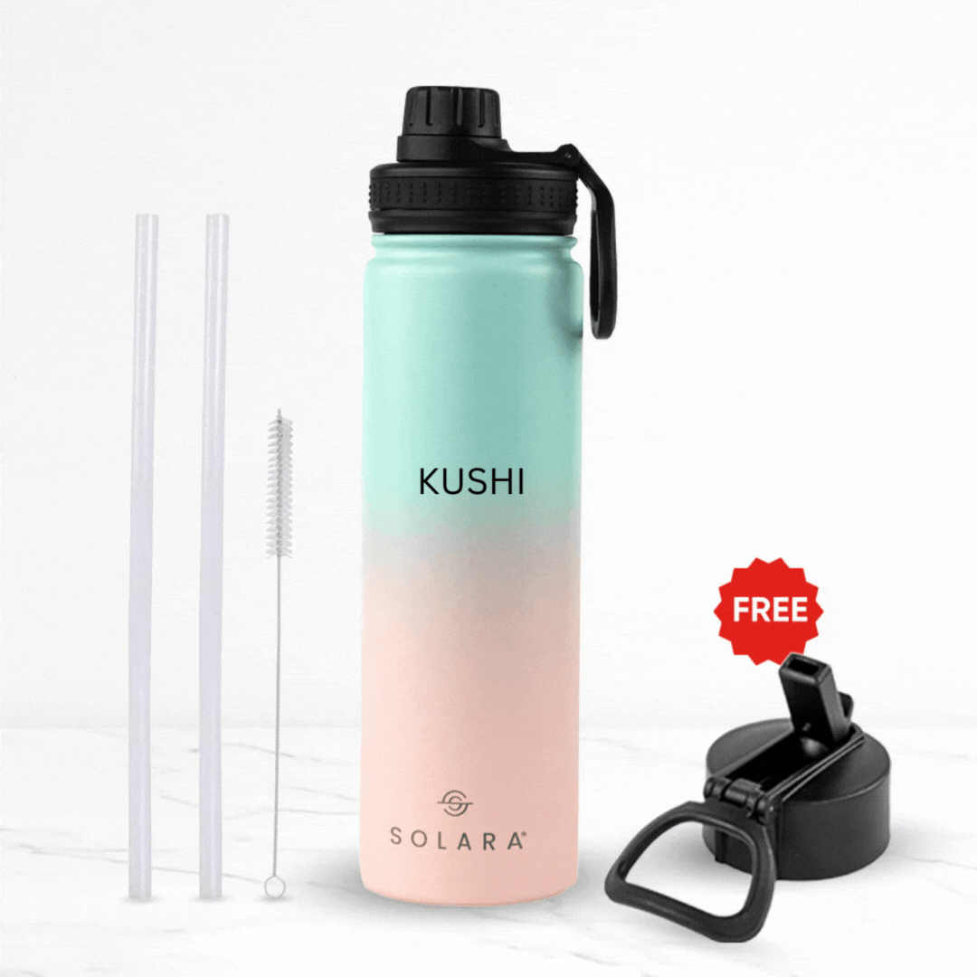 Gradient water bottle with straws, brush, and extra lid on white background.