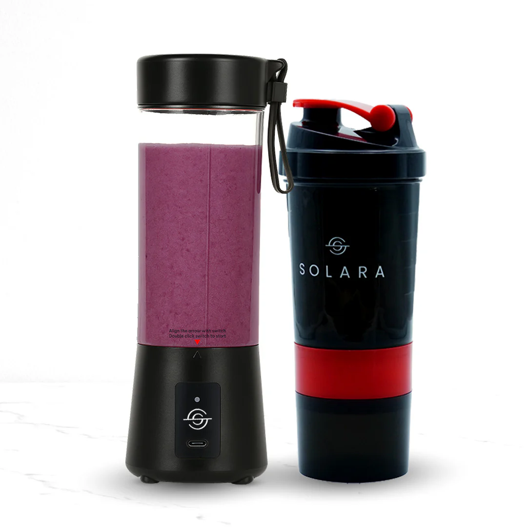 Portable blender with purple smoothie next to a black and red shaker bottle.
