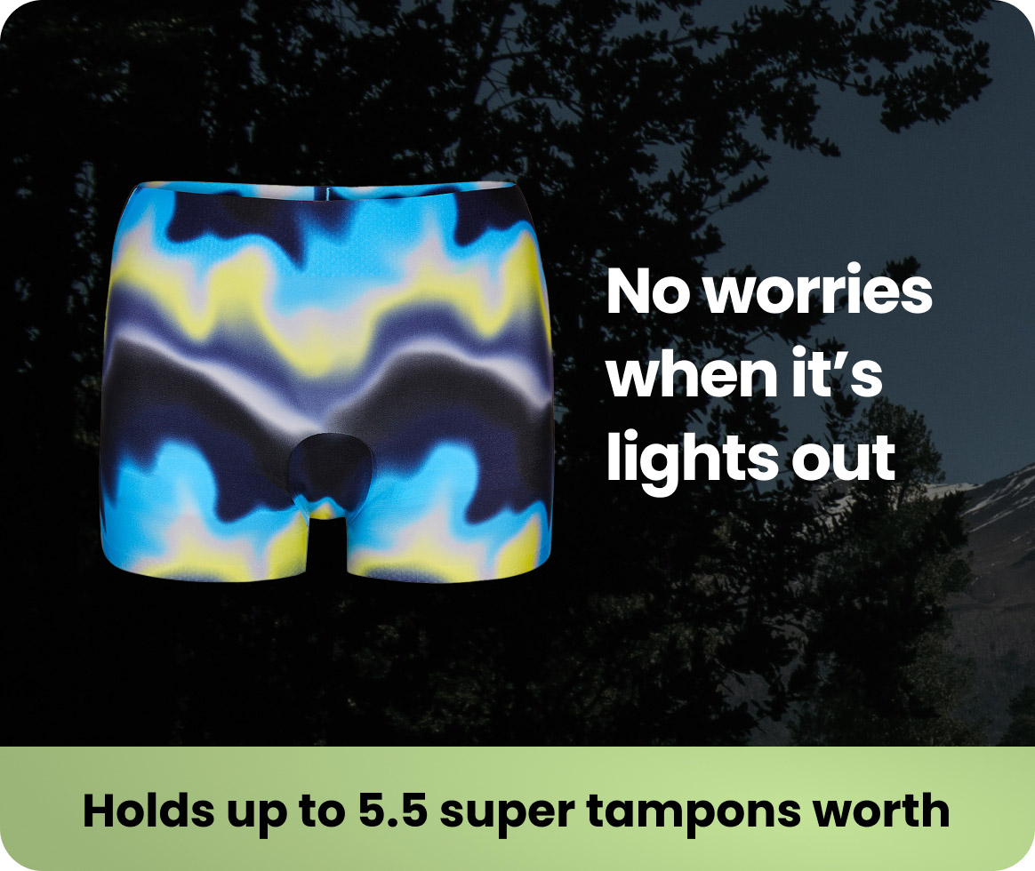 Colorful boxer shorts with text about absorbency and nighttime use.