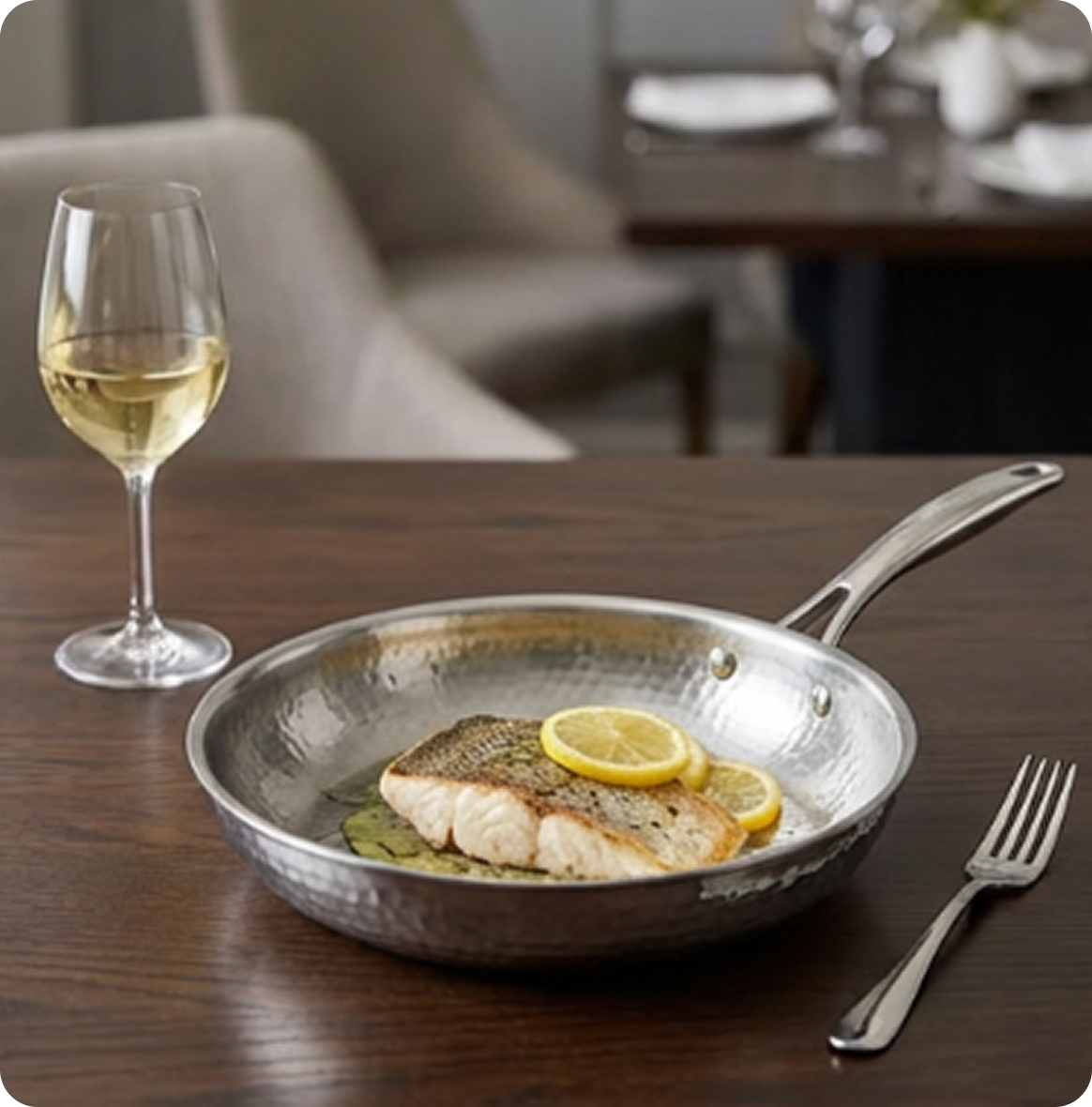 A stainless steel frying pan with colorful sliced vegetables sautéing on a gas stovetop in a kitchen.
