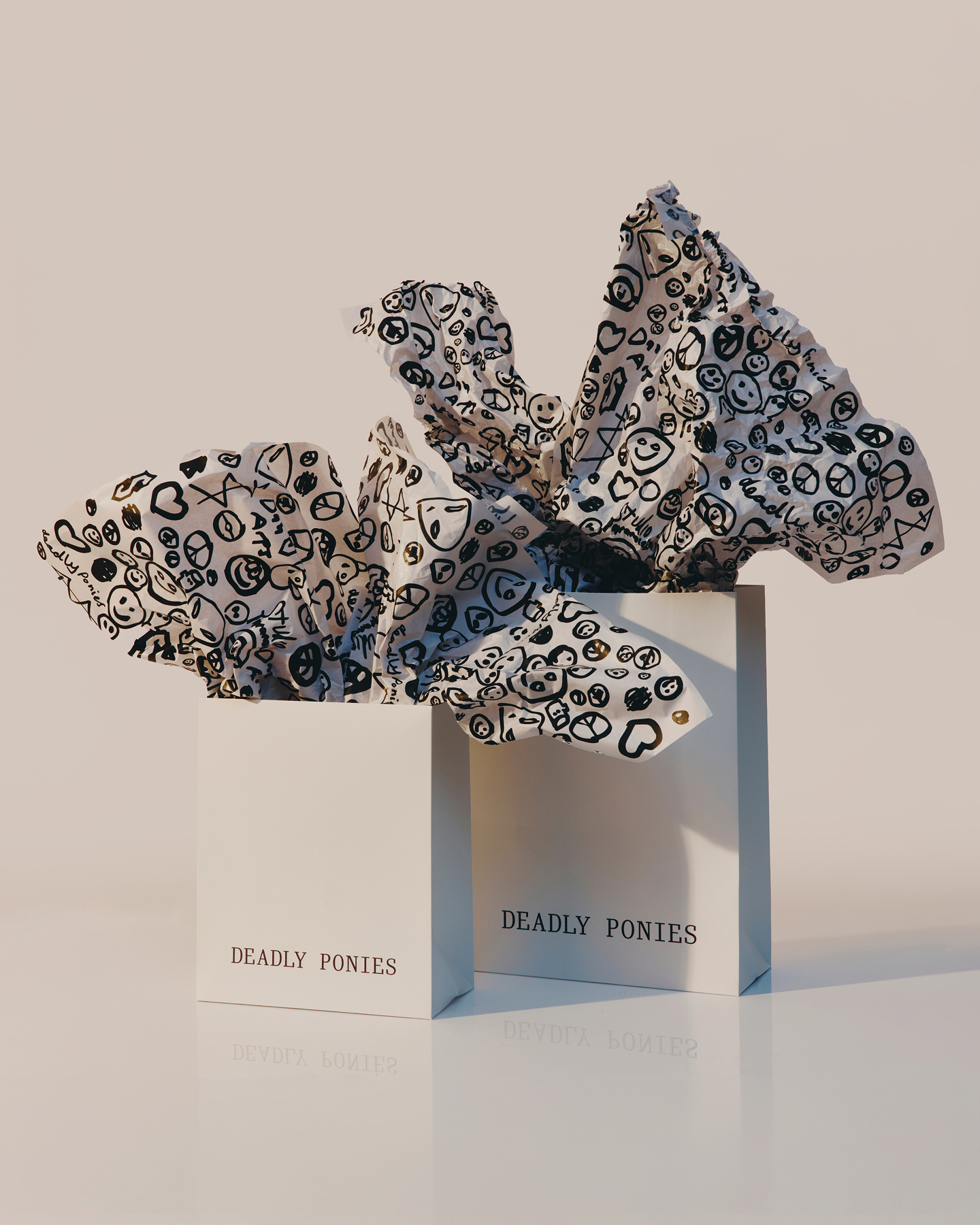 Two shopping bags with patterned tissue paper inside.