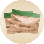 Two brown and green packets with 'earthy energy' text on them.