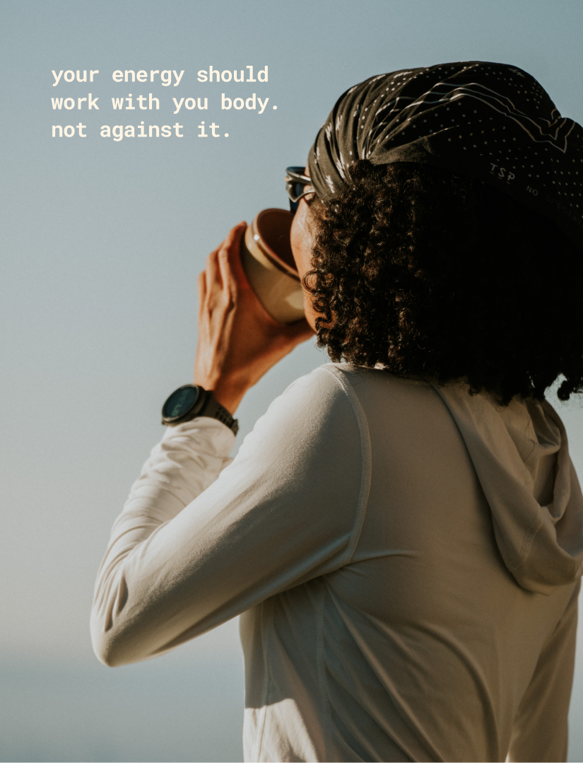 Person wearing a cap and jacket drinks from a cup, text overlay: 'your energy should work with you.'