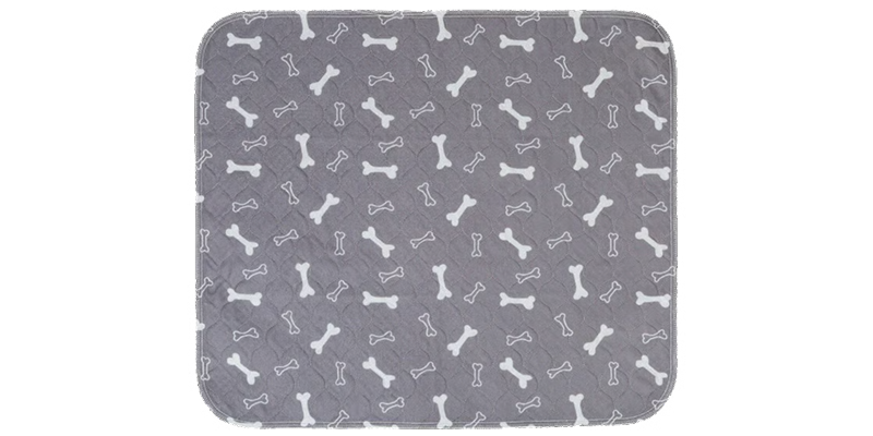 A gray quilted pad with a repeating pattern of white dog bones on a white background.
