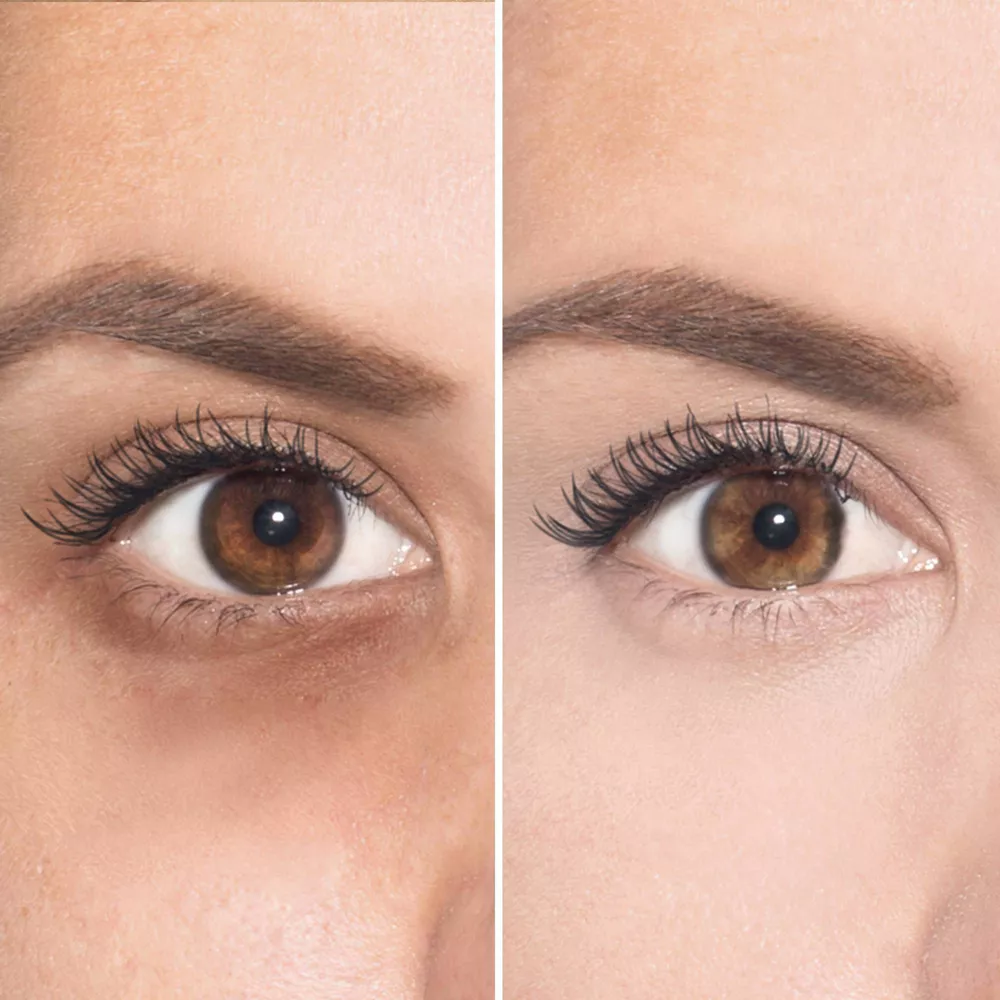 Close-up of two eyes, showing before and after makeup application.