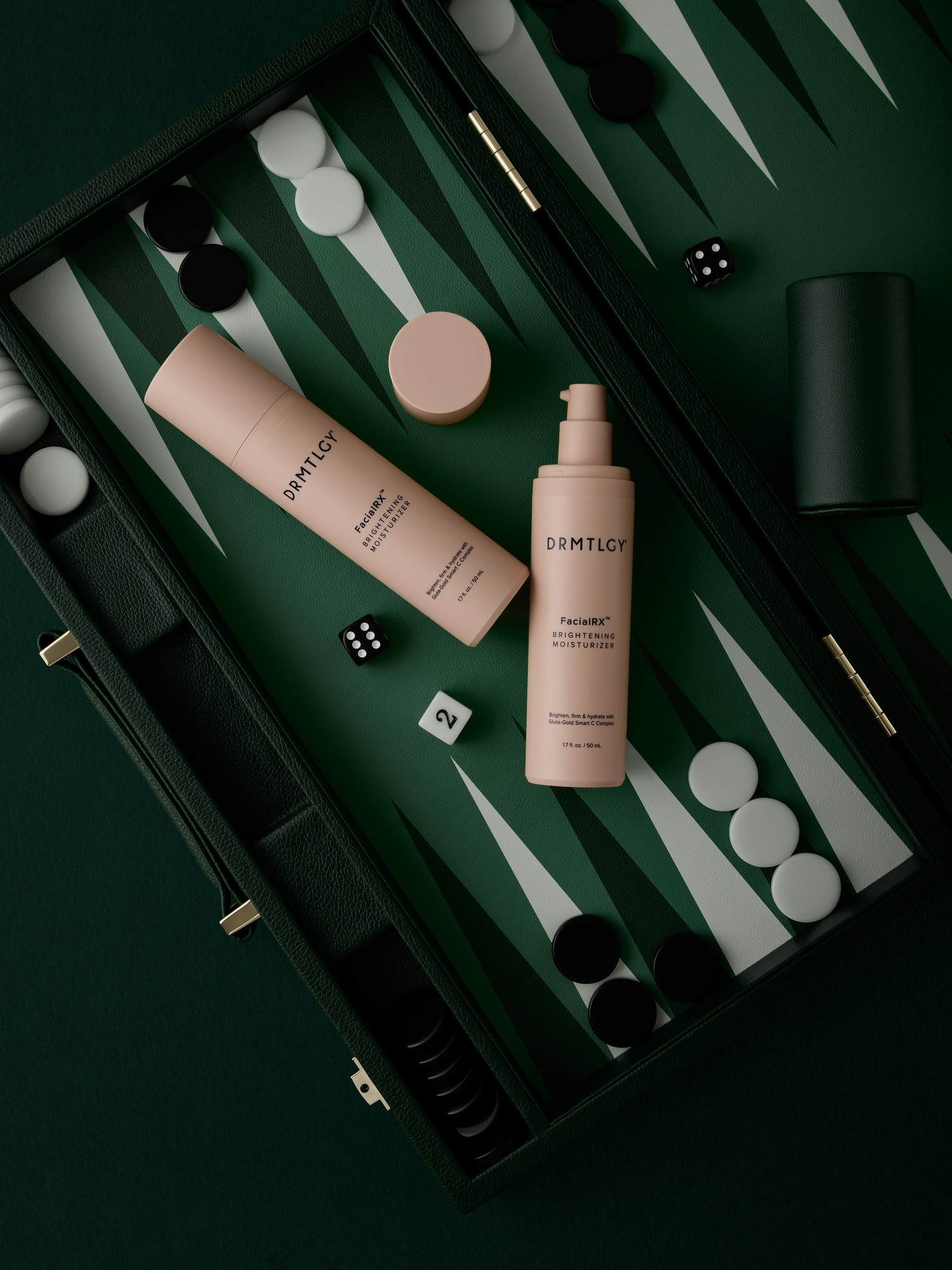 Two pink bottles of DRMTLGY moisturizer are displayed on a green backgammon board with game pieces.