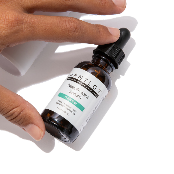 Hand holding a bottle of needle-less serum with dropper.