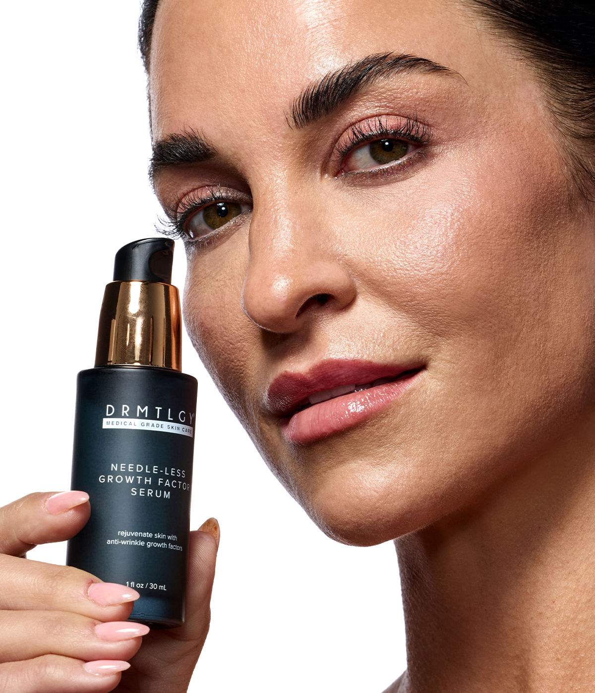 Close-up of a person holding a skincare serum bottle.