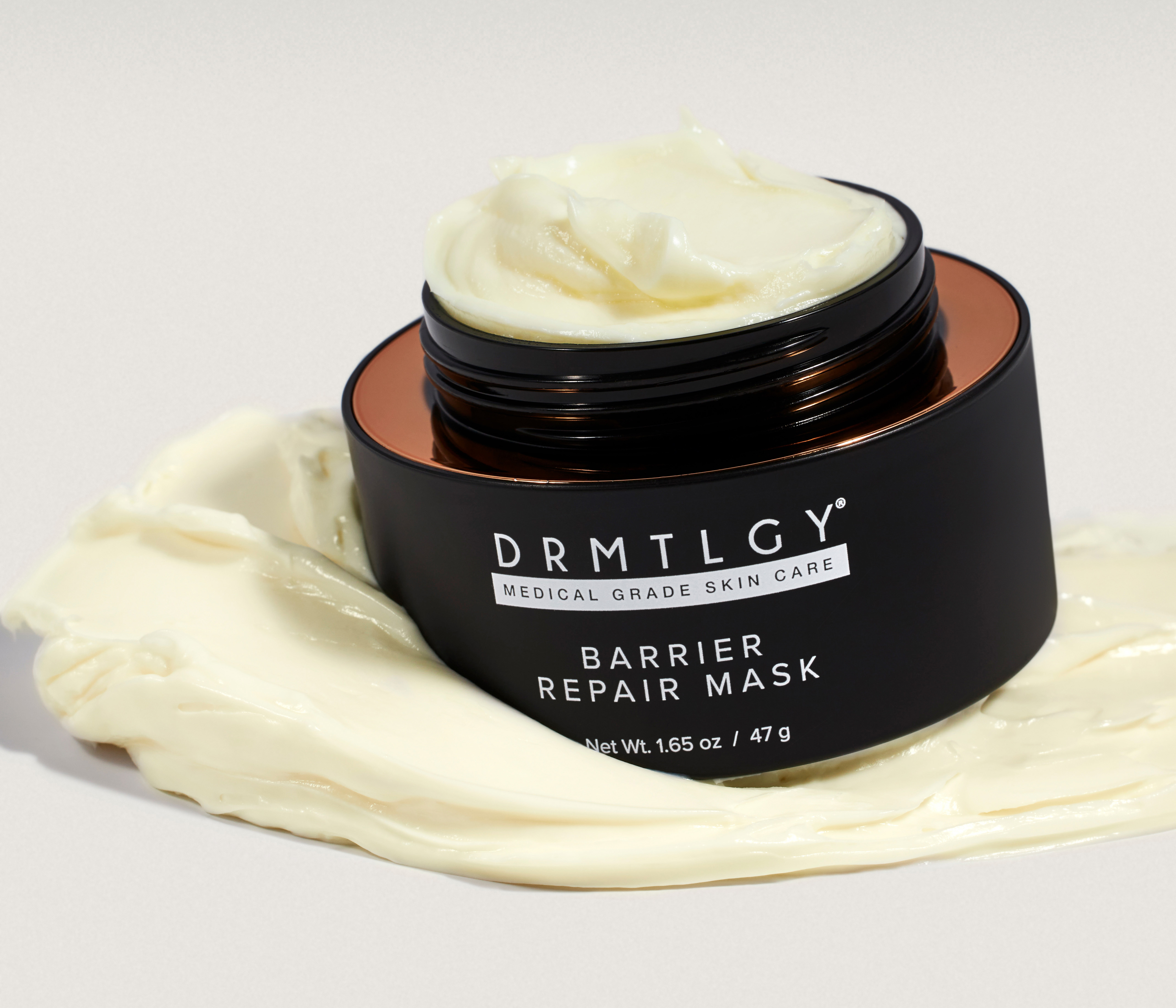 Black jar of barrier repair mask with cream texture.