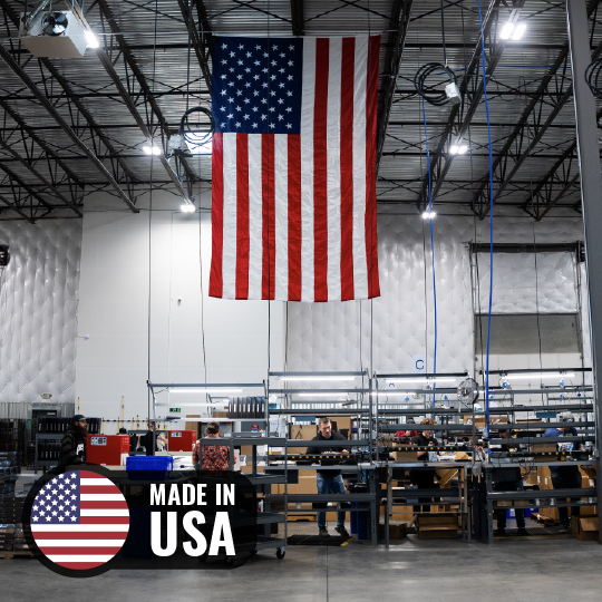 American flag hanging in a factory with 'Made in USA' label.