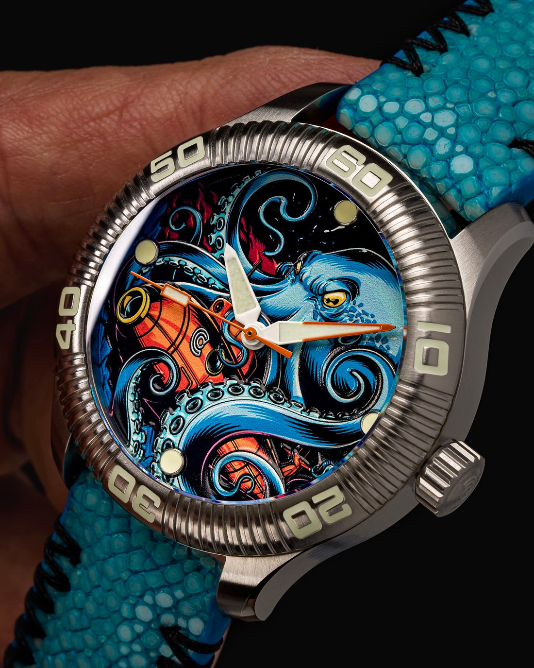 A close-up of a wristwatch featuring a colorful illustration of an octopus on its face.