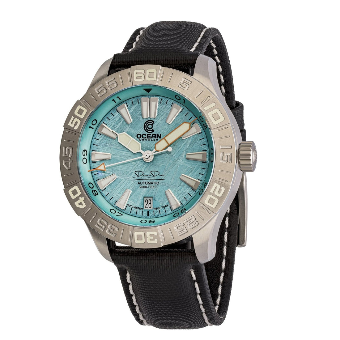 An Ocean Crawler dive watch with a silver bezel, textured turquoise dial, and black band with white stitching.