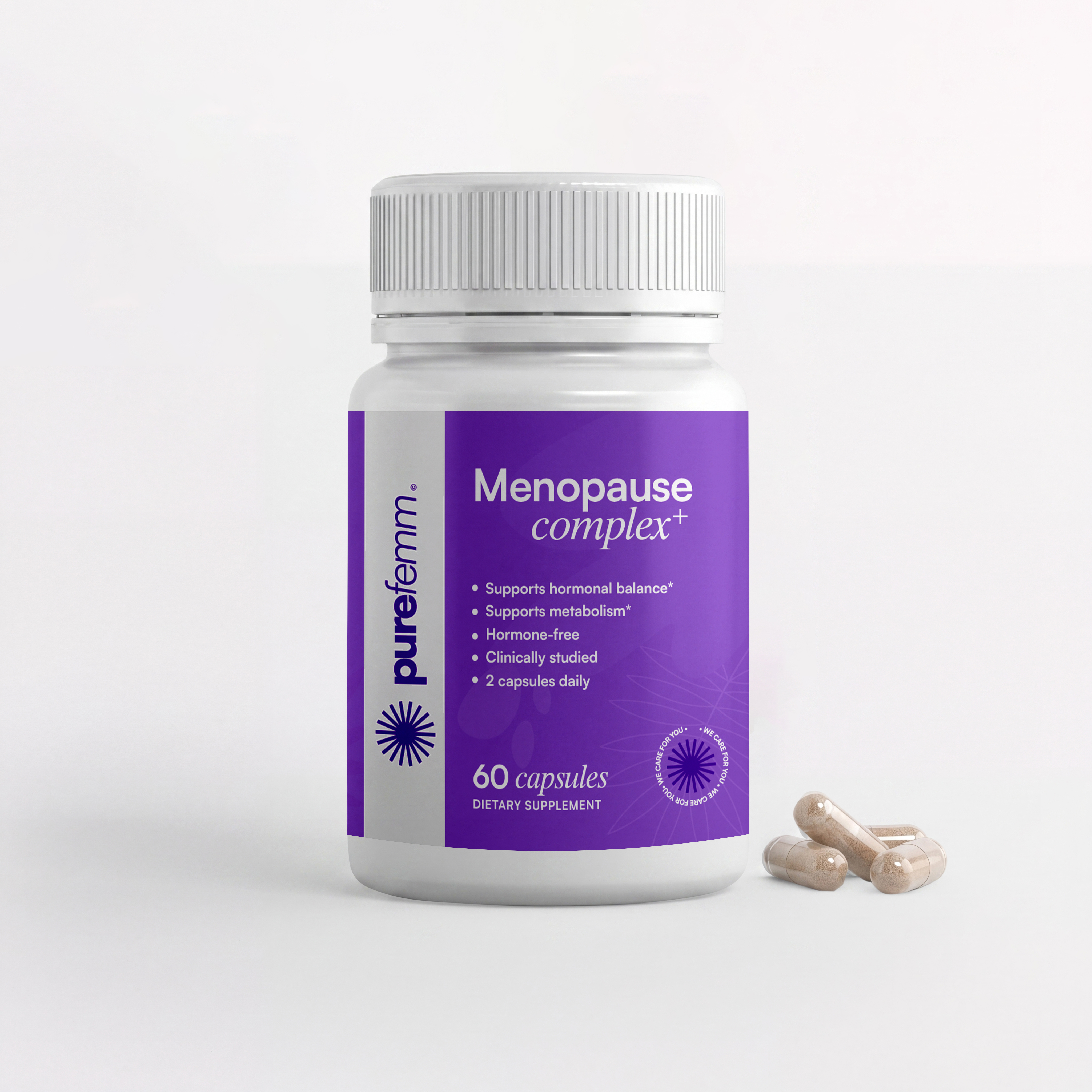 A white bottle of purefemm Menopause complex+ dietary supplement with three capsules next to it.