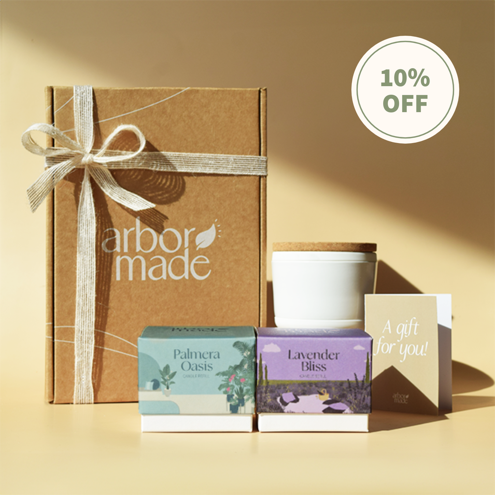 Gift set with candles, boxes, and a card, labeled '10% OFF'.