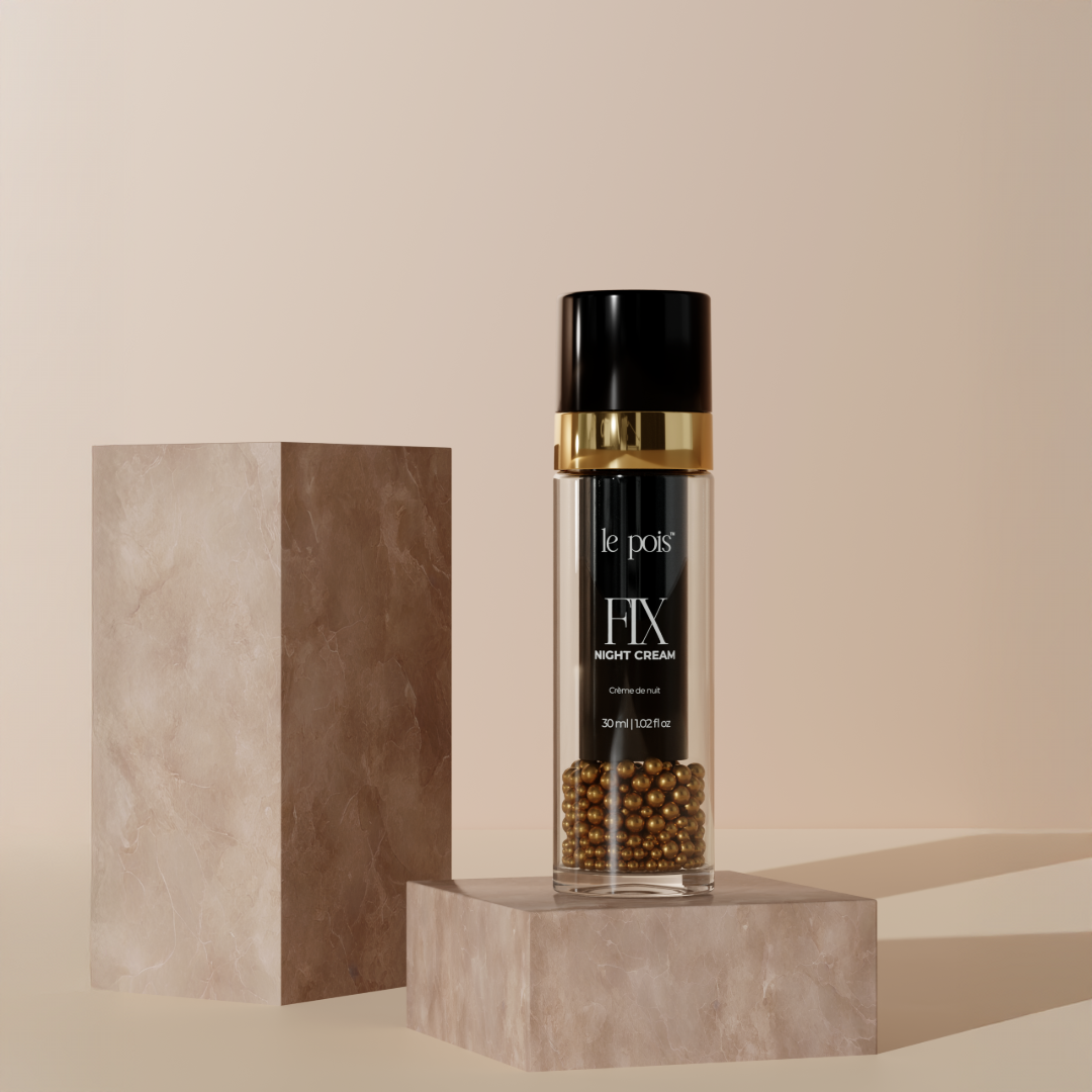 Night cream bottle on a marble pedestal with a beige background.