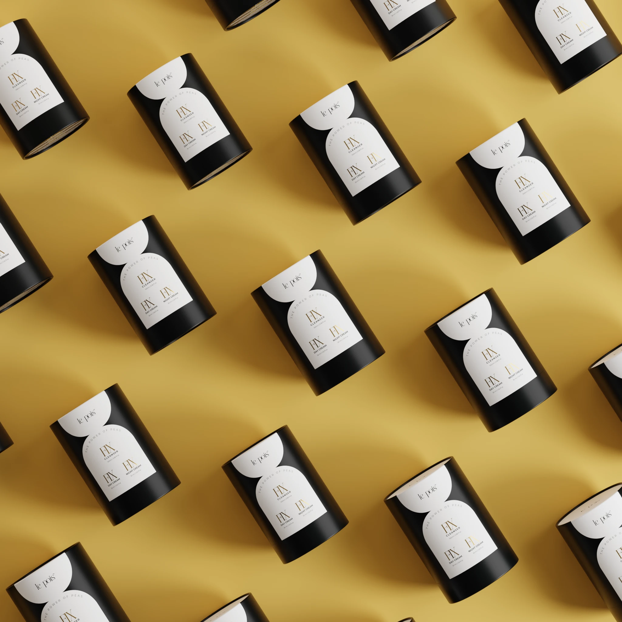 Pattern of black cylindrical containers on a yellow background.
