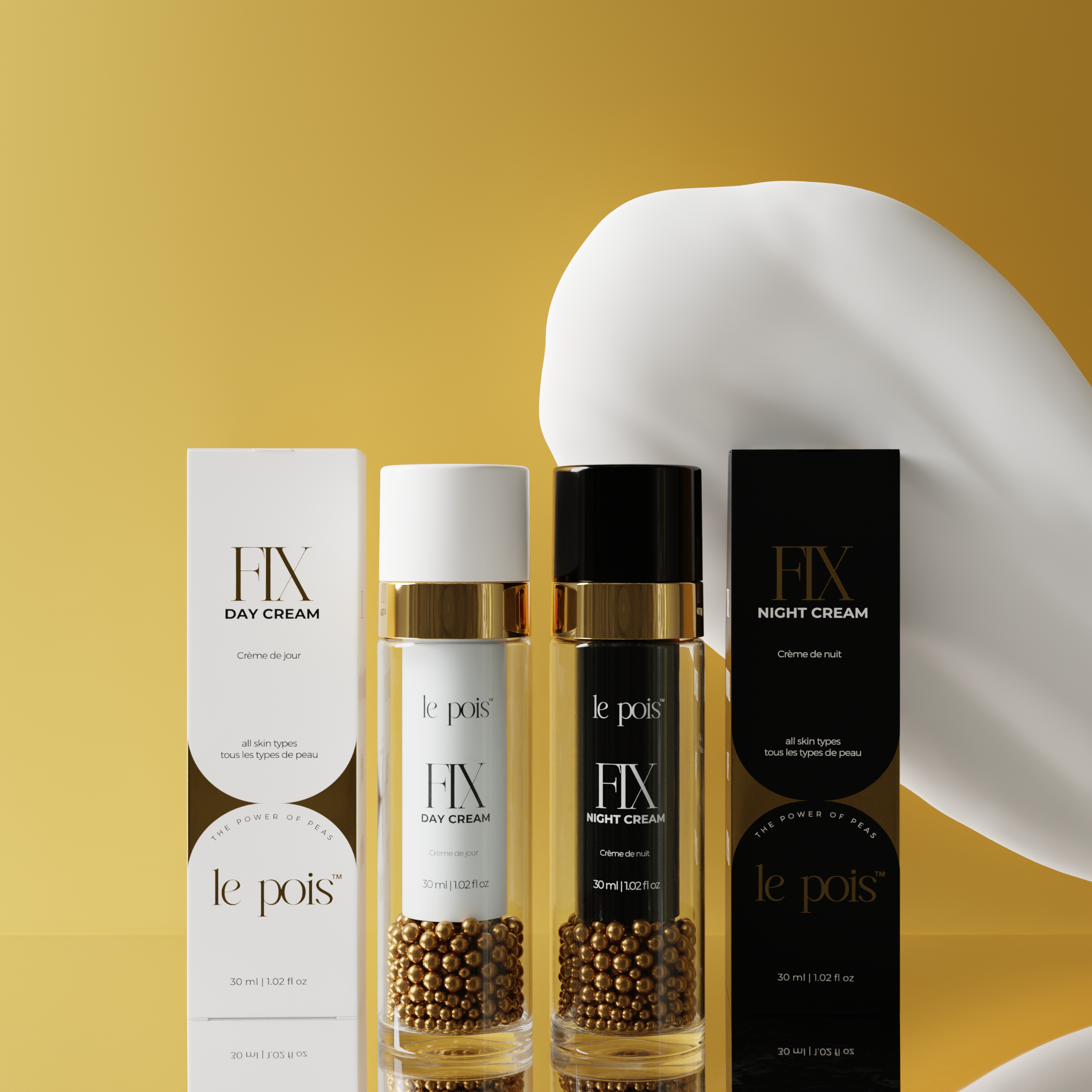 Day and night cream bottles with gold accents and packaging on a yellow background.