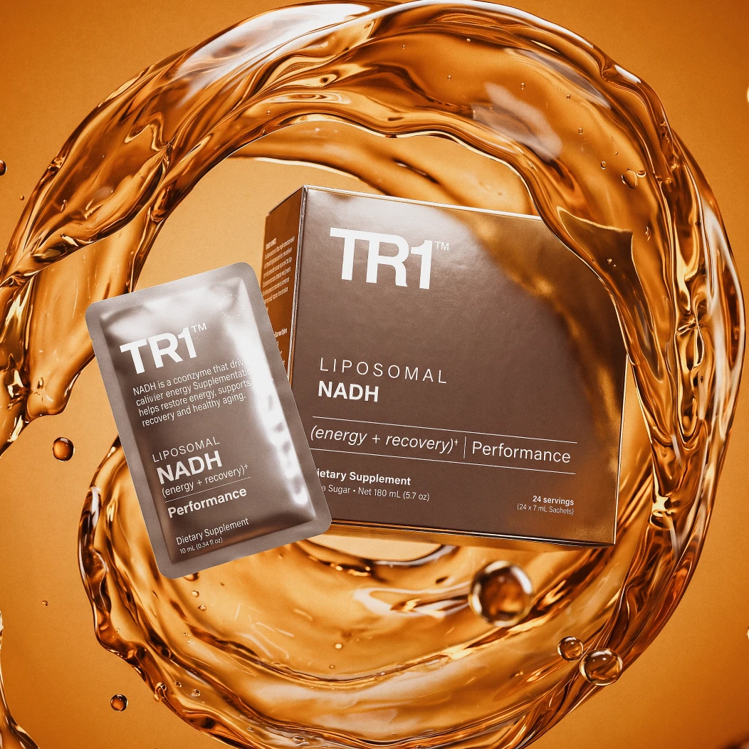 A box and single-serving packet of TR1 Liposomal NADH supplement in a splash of amber liquid.