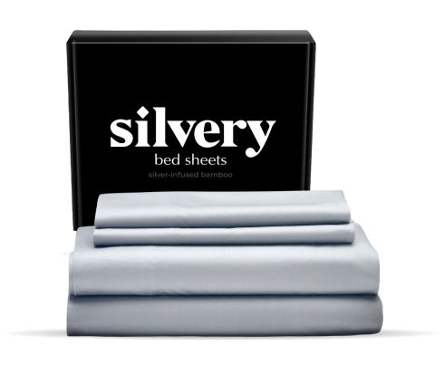 Silver-infused bamboo bed sheets next to packaging box.