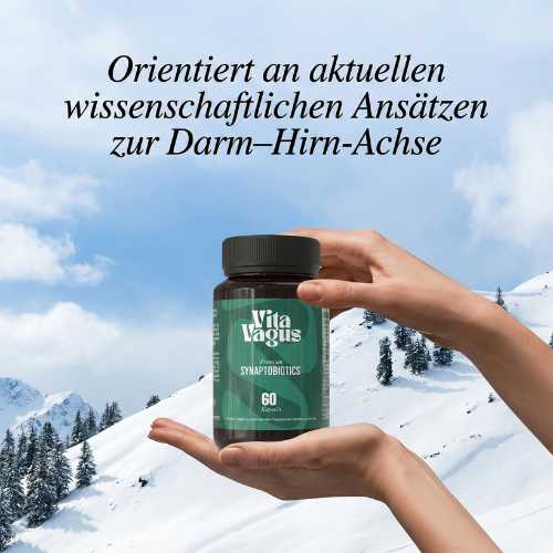 Hands holding a bottle against a snowy mountain background with German text above.