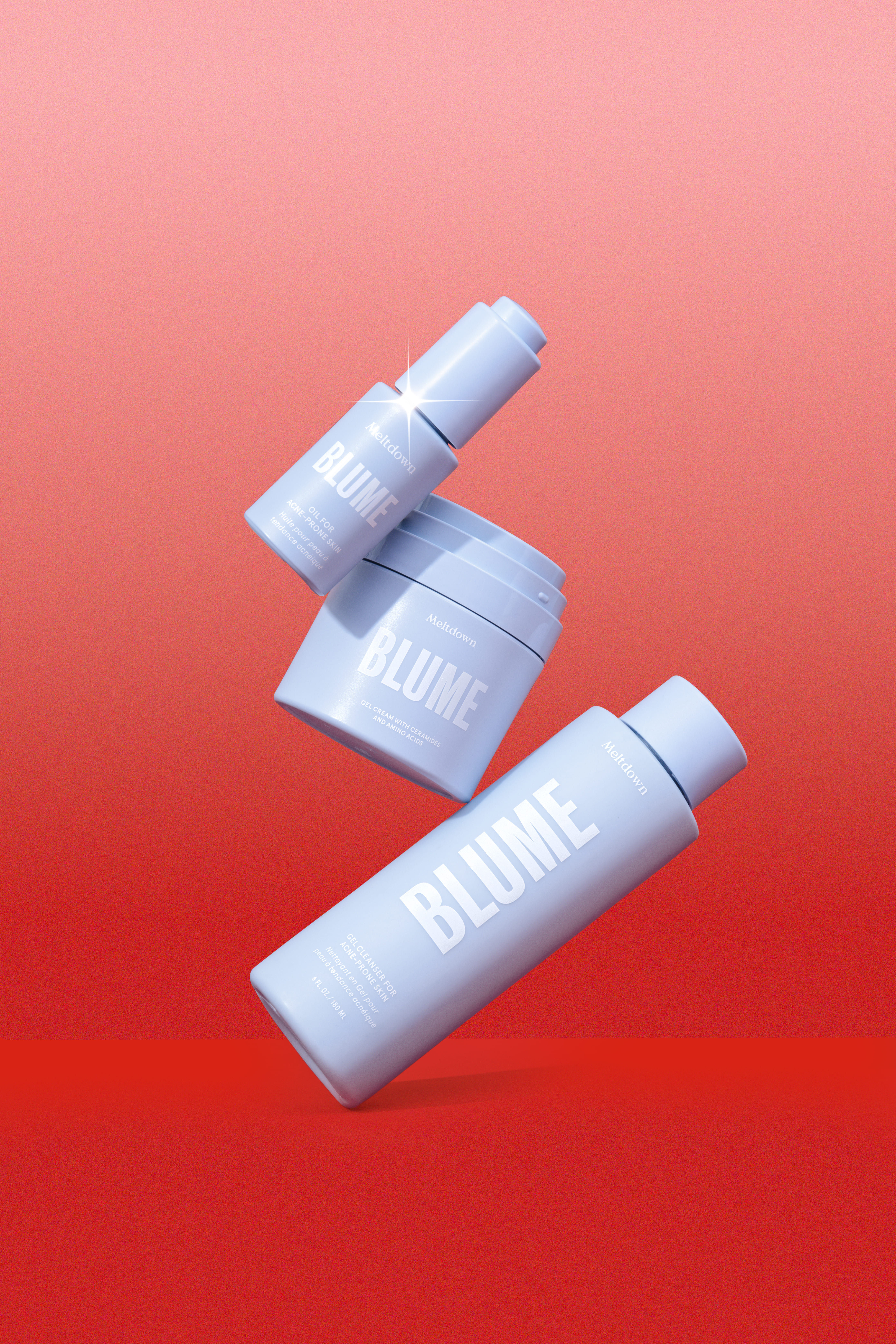 Three Blume skincare products against a red background.