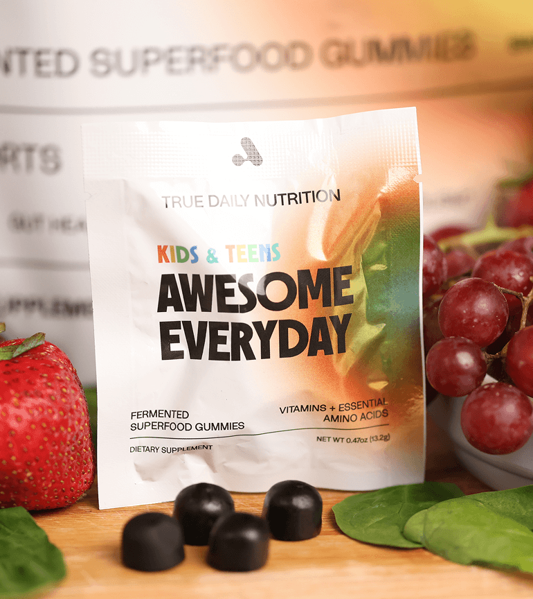 Packet of gummies with strawberries, grapes, and black candies.