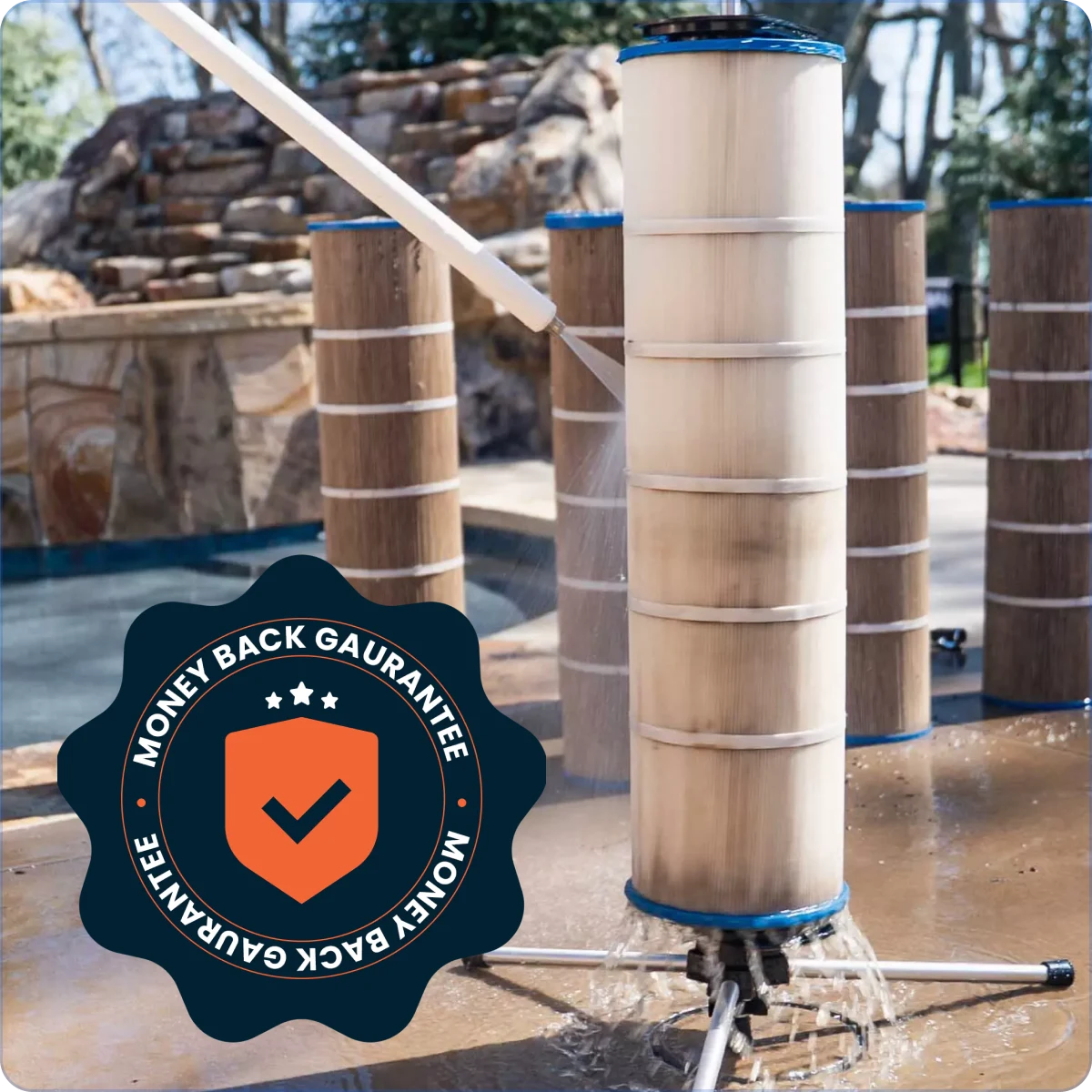 A person cleans a dirty pool filter cartridge with a water sprayer next to a pool.