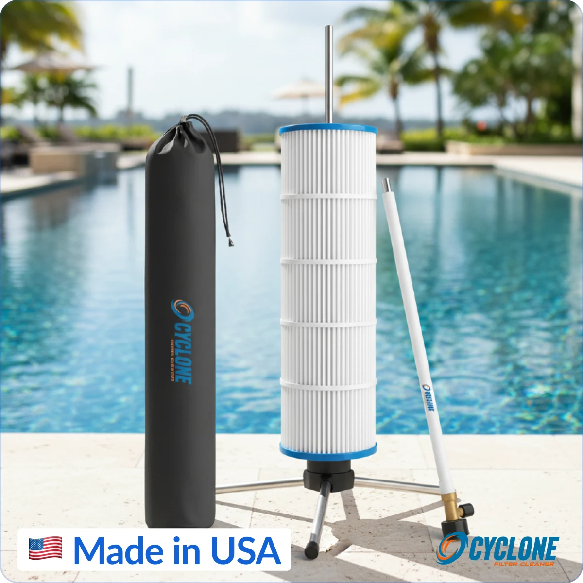 A Cyclone pool filter cleaner on a tripod stand with its cleaning wand and carry bag beside a pool.