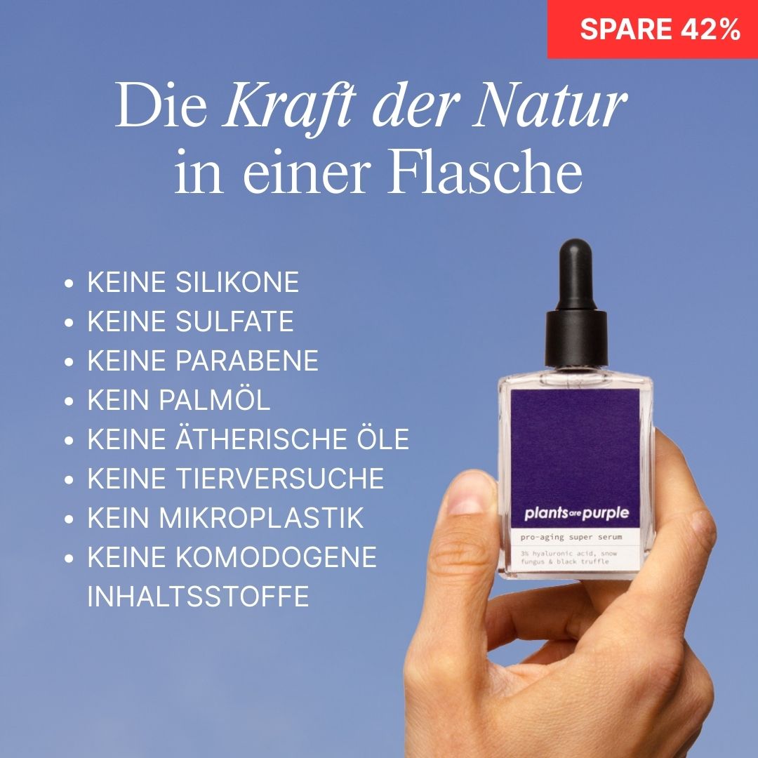 Hand holding a serum bottle with German text listing ingredients and benefits.