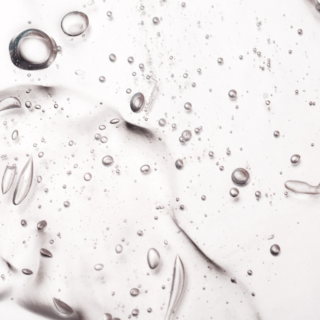 Clear gel with air bubbles on a smooth surface.