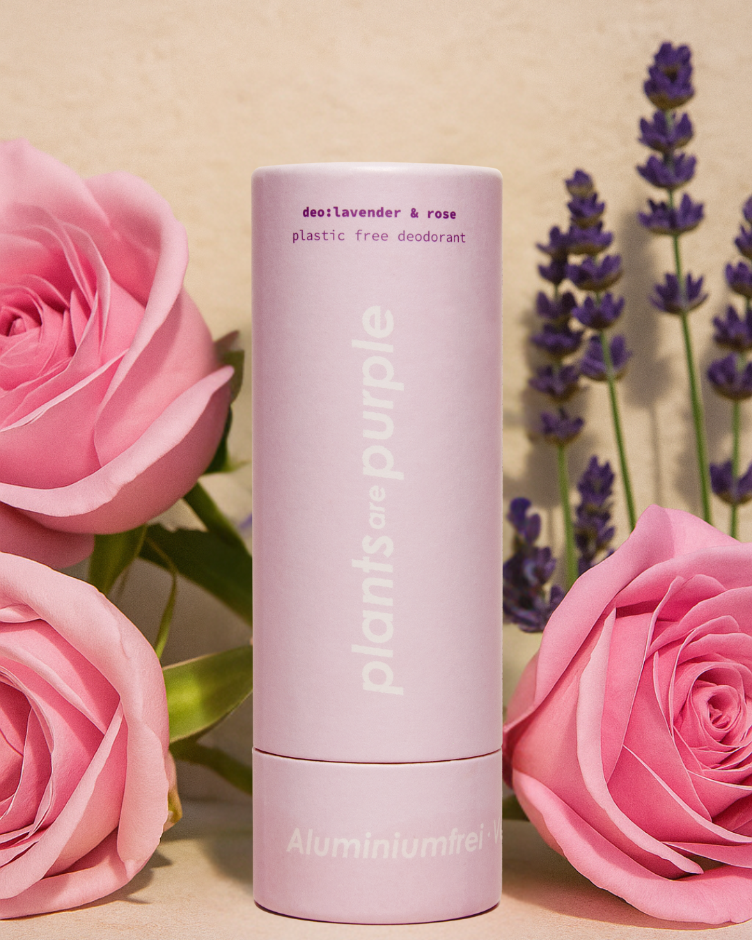 Pink deodorant tube with roses and lavender flowers.