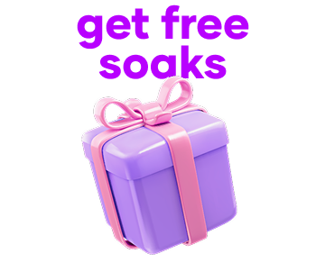 Purple gift box with pink ribbon, text: 'get free soaks'.