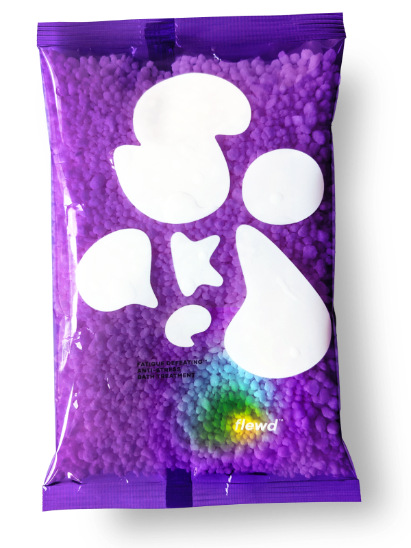 Purple bag of bath treatment with abstract white shapes and 'flewd' text.