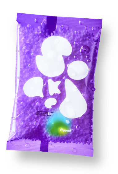A wet, translucent purple packet filled with small purple beads, shown on a white background.