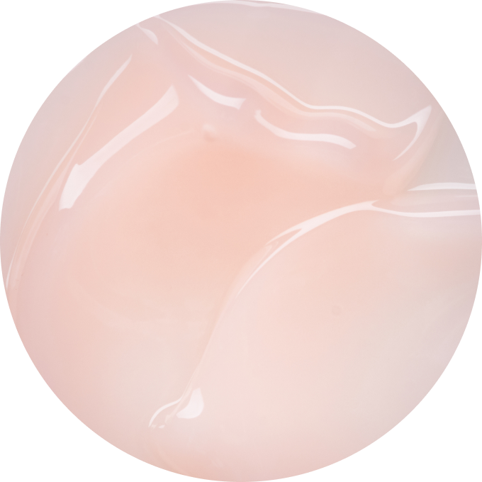 Close-up of a smooth, glossy, light pink gel texture.