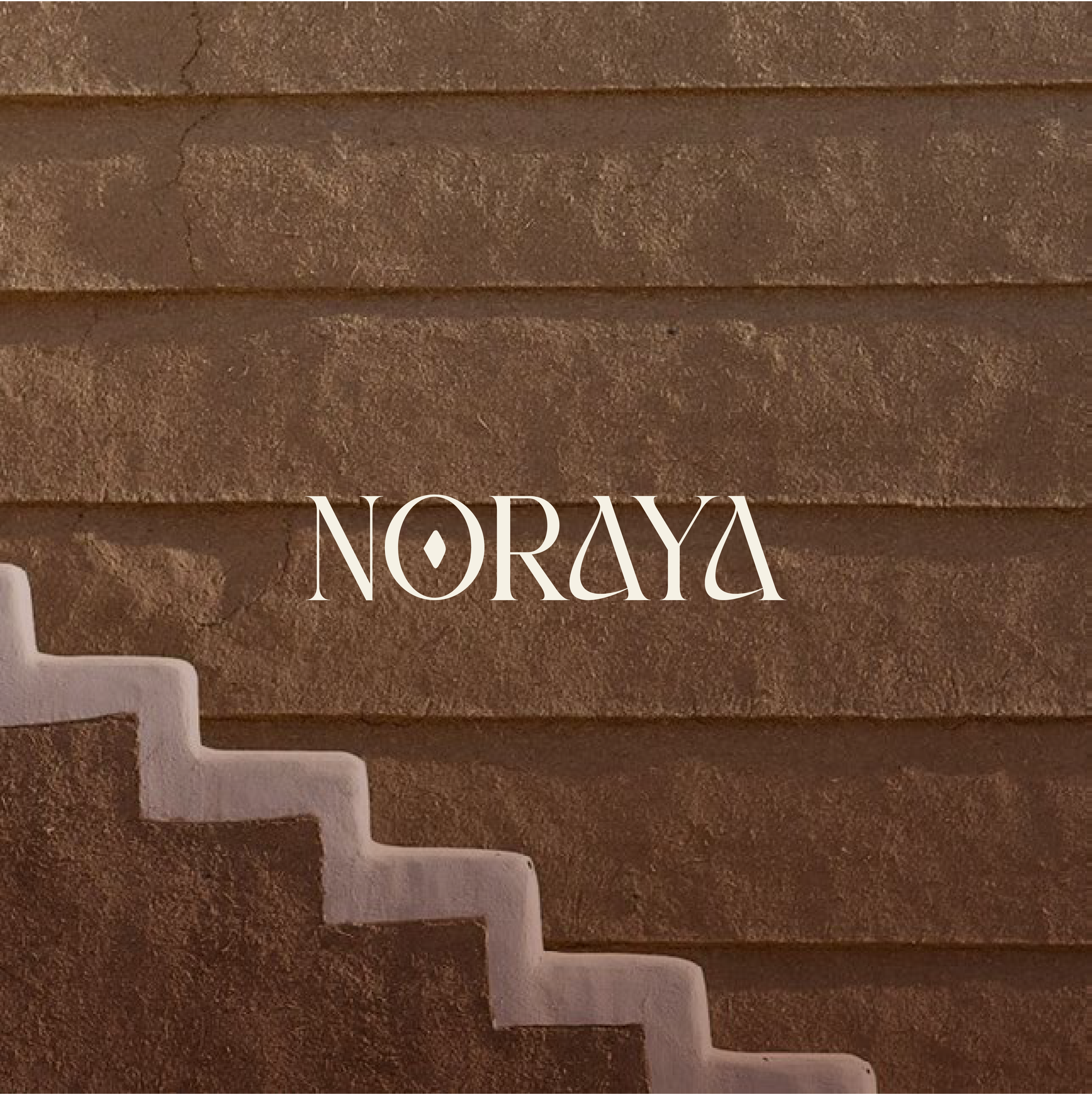 Brown textured wall with white stairs and 'NORAYA' text.