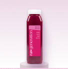 Bottle of red juice with a white cap on a small pedestal against a pink background.